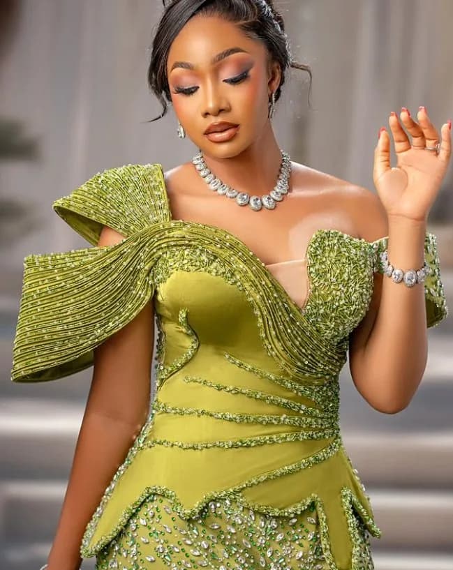 Olive Sculpt Gown: Pleated satin with a sculpted beaded shoulder